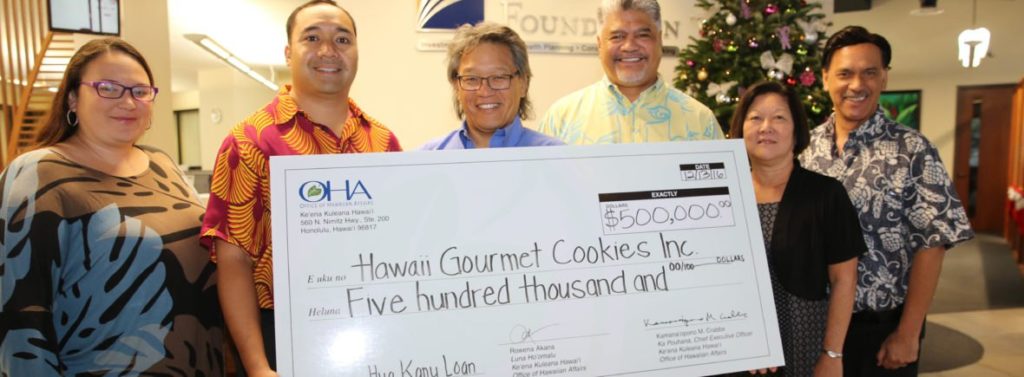 Photo: Hawaii Gourmet Cookies Staff holding a check